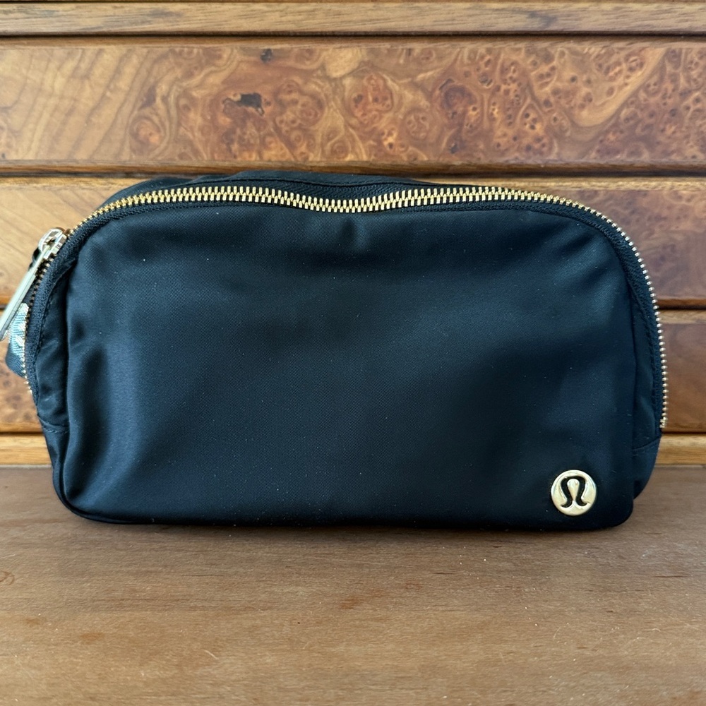 lululemon Black Crossbody Bag with Gold Details Wordmark Strap 1L Size